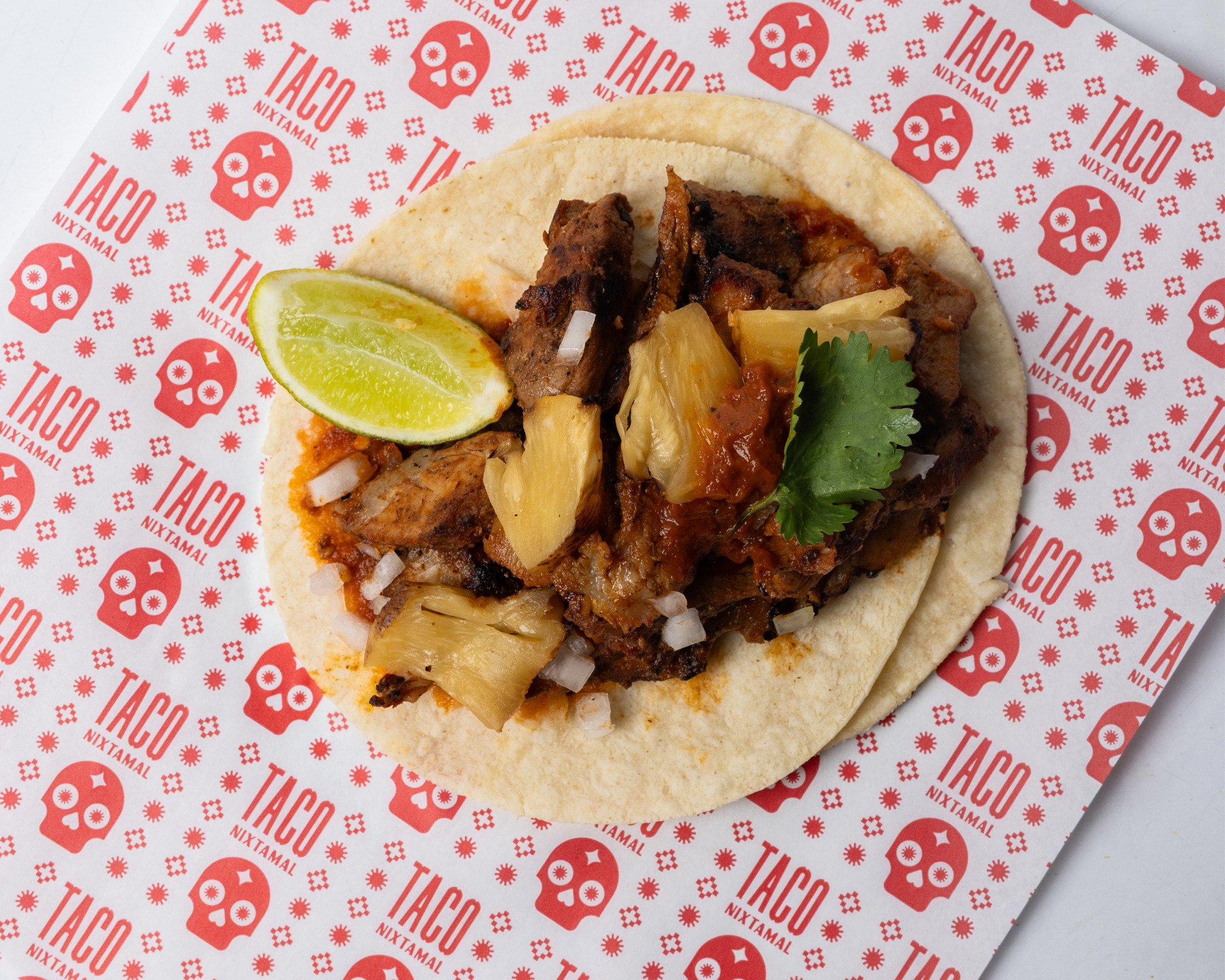 A delicious plate of authentic Mexican tacos with slow-cooked pork shoulder and fresh toppings